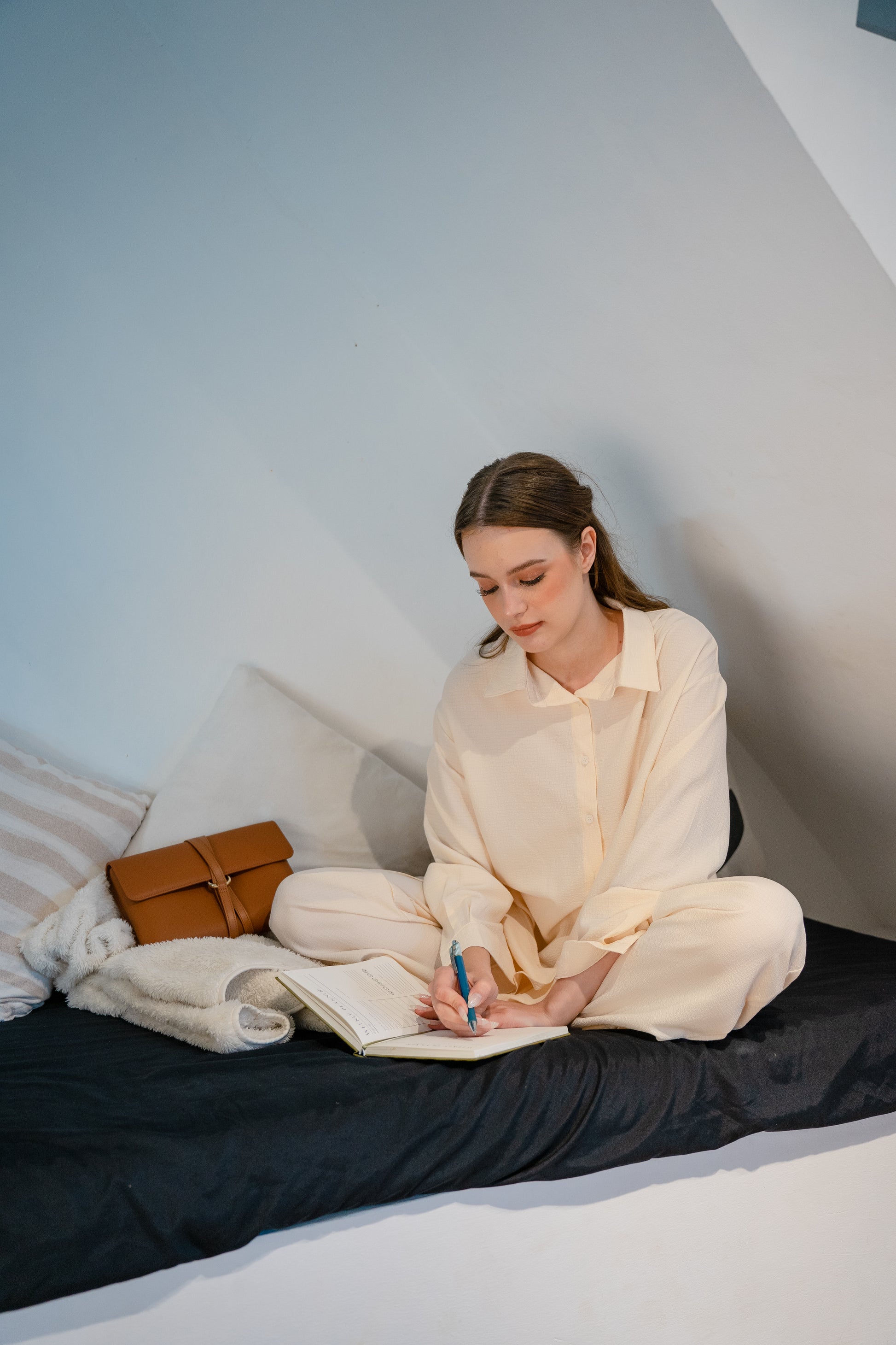 The Cloud Clutch in Tan